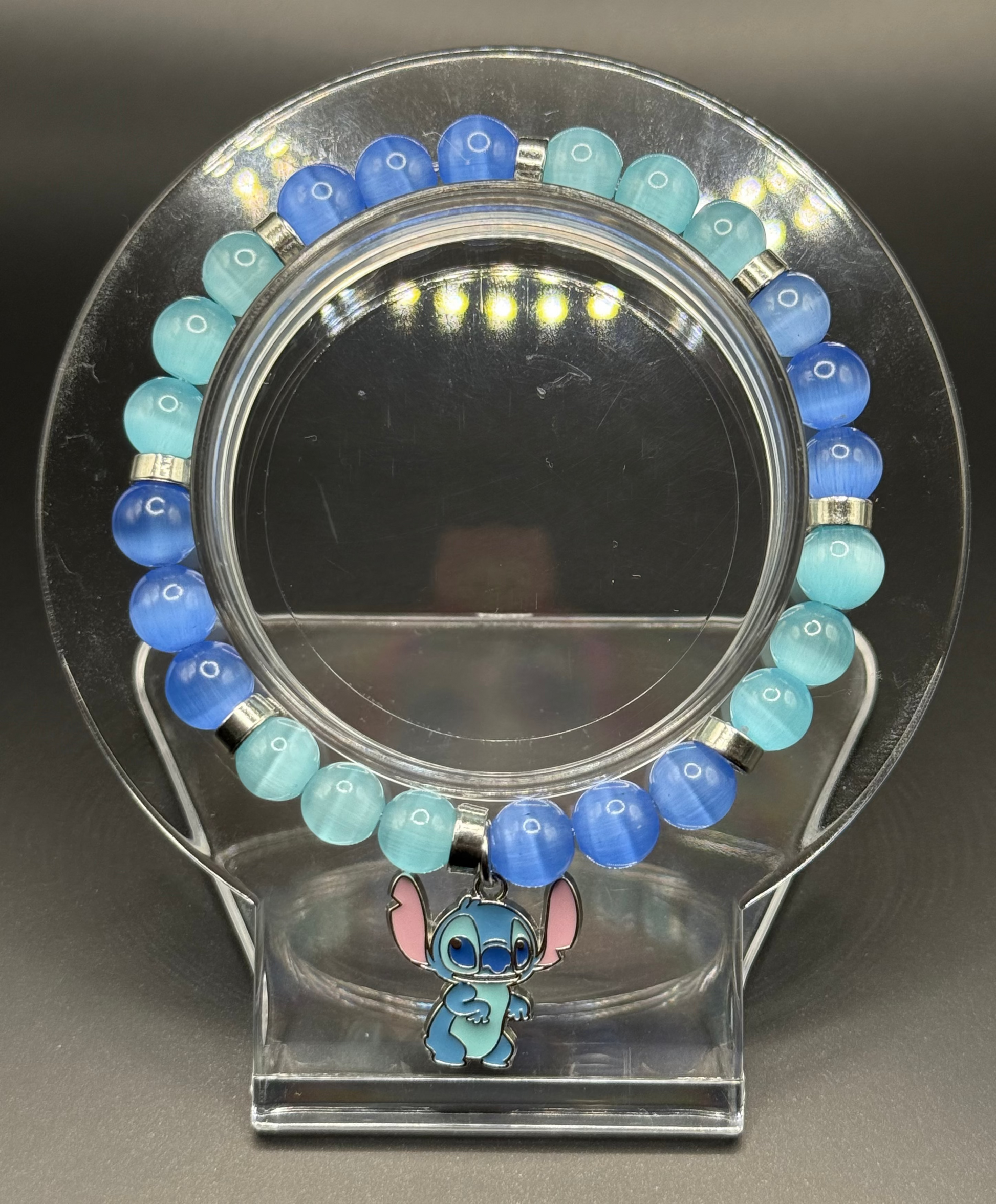 Blue and green beaded bracelet with a Stitch charm from Lilo & Stitch